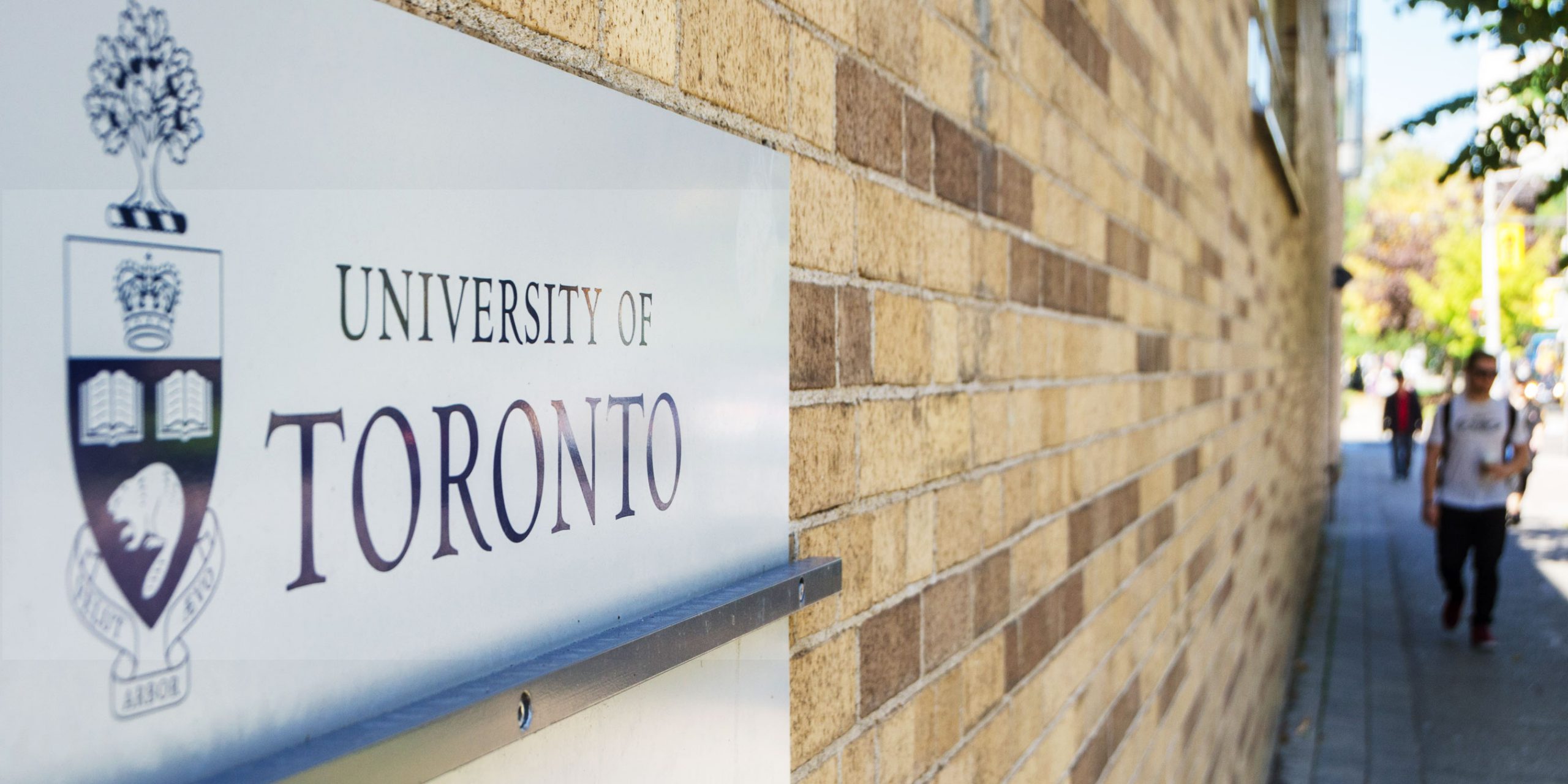 Universty of Toronto sign on brick wall